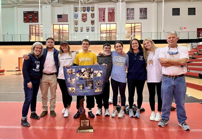 Mikey Frederick reaches 100 wrestling wins. Shown are (l-r) Liza Frederick, Patrick Davis, Anna Frederick, Mikey Frederick, Davey Frederick, Katie Frederick, Lizzie Frederick, Marisa Conte and Dave Frederick. SUBMITTED PHOTO